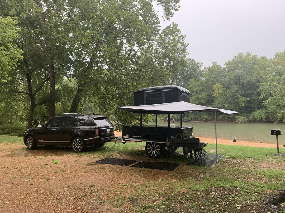 XV-2 parked lakeside with the awning extended over the camp area — photo 8