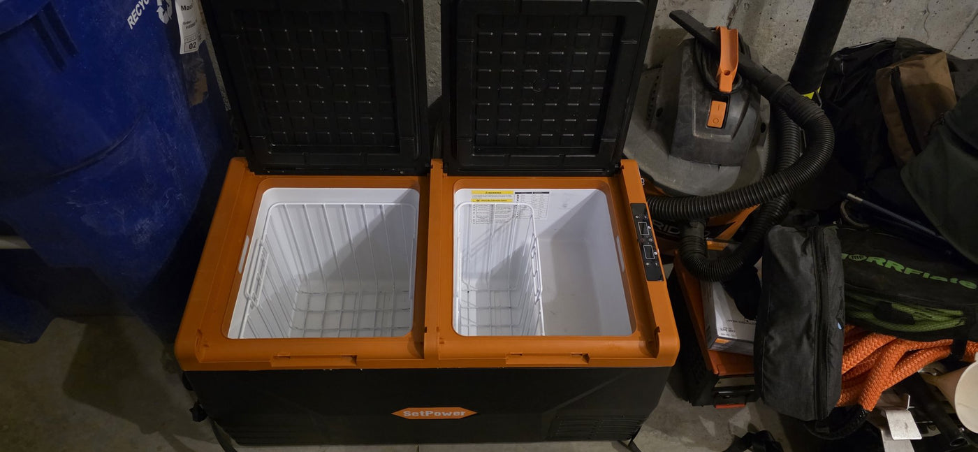 Overhead view of the Setpower fridge/freezer's two insulated compartments with wire baskets — photo 2