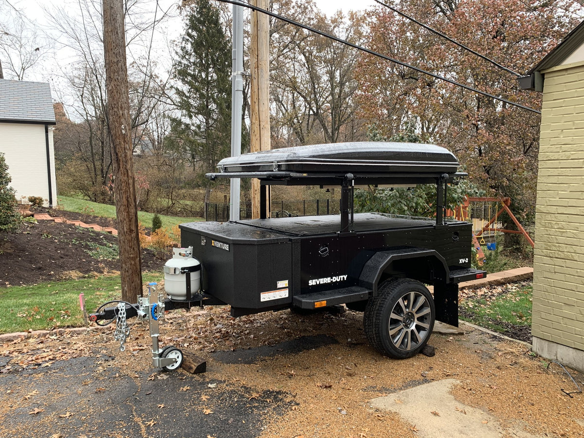 Side view of the trailer with the trailer-length food prep and service table folded out — photo 4