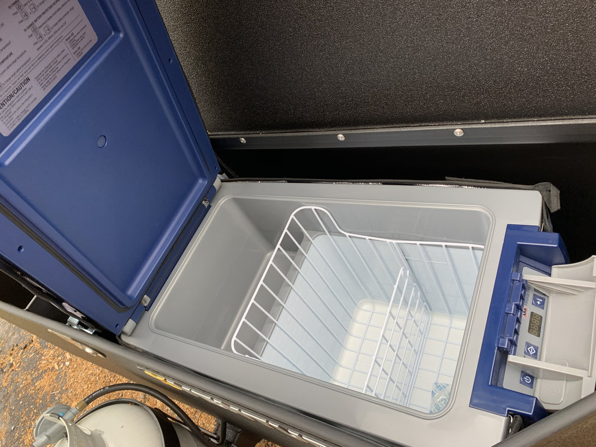 ARB refrigerator/freezer with the lid open, showing the wire basket and digital control panel — photo 21
