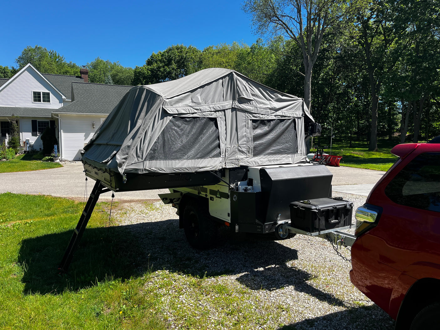Patriot X3 trailer parked at home, tent up, three-quarter angle