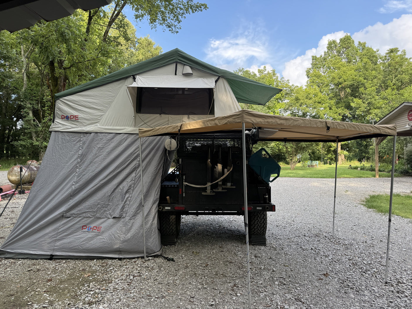 Pope Overland rooftop tent fully set up with annex room and 270-degree awning deployed