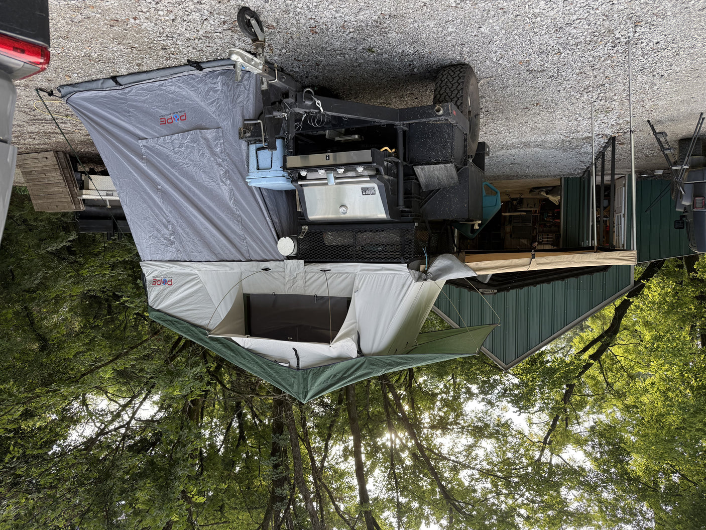 Side view of the Pope rooftop tent, annex room, and awning extended