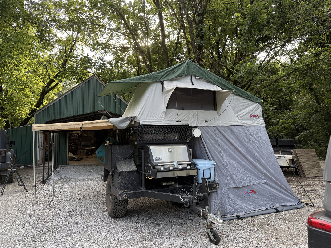 Side view of the Pope rooftop tent, annex room, and awning extended