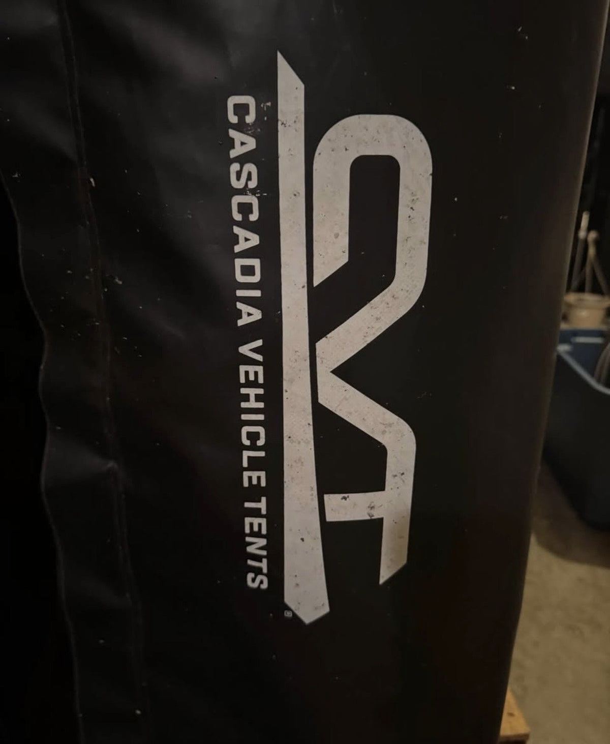 Close view of the Cascadia Vehicle Tents logo on the tent travel cover — photo 6