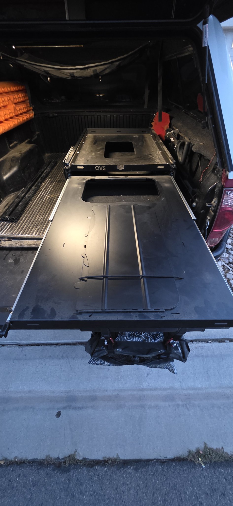 OVS fridge slide fully extended past the tailgate with the fold-out prep panel deployed — photo 3