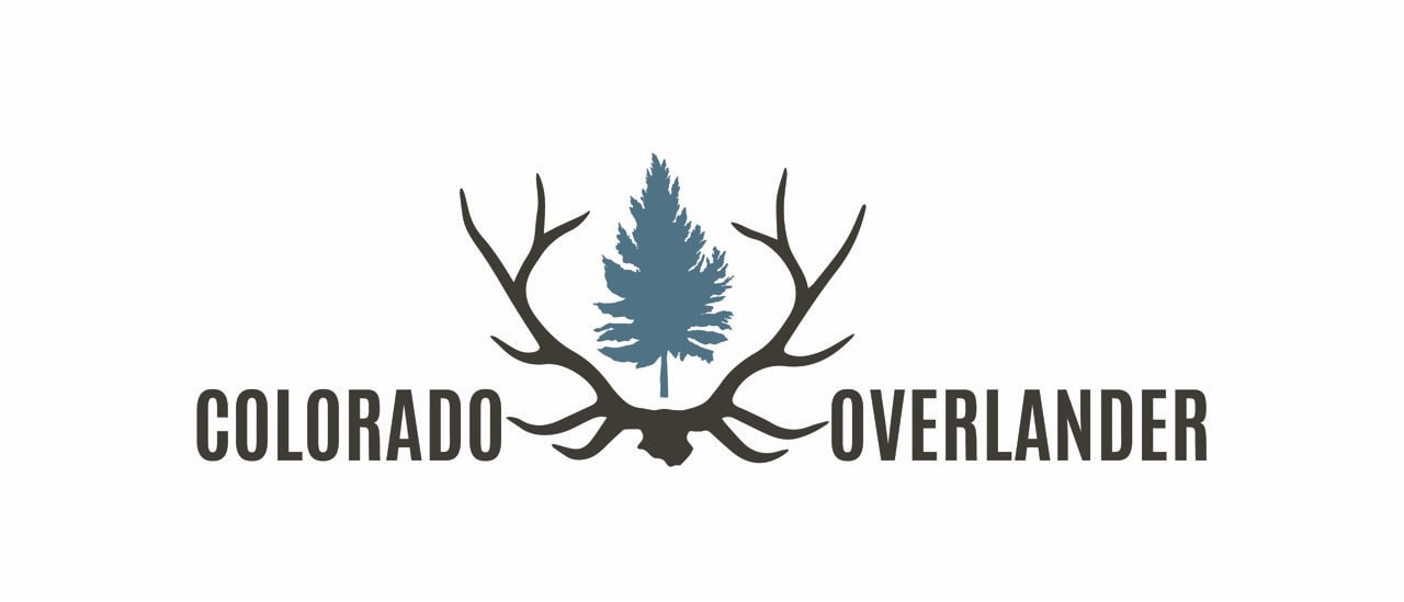 featuring a pine tree and antlers.