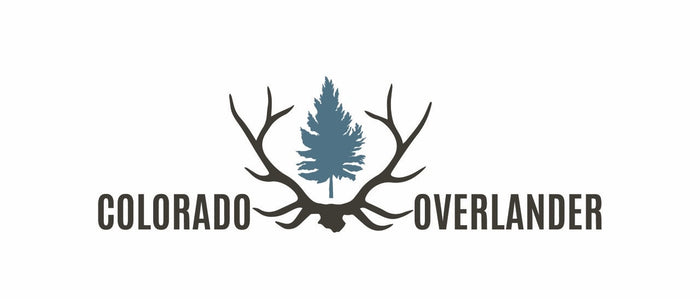 featuring a pine tree and antlers.