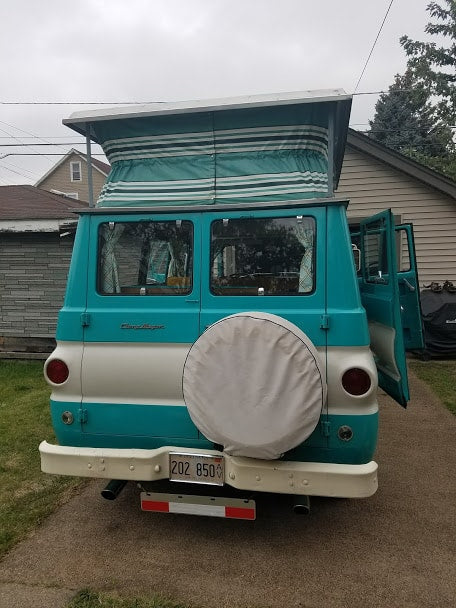 ready for your next RV rental adventure.|Rear view: Vintage turquoise & white Corvair 95 pop-top camper van. Open doors