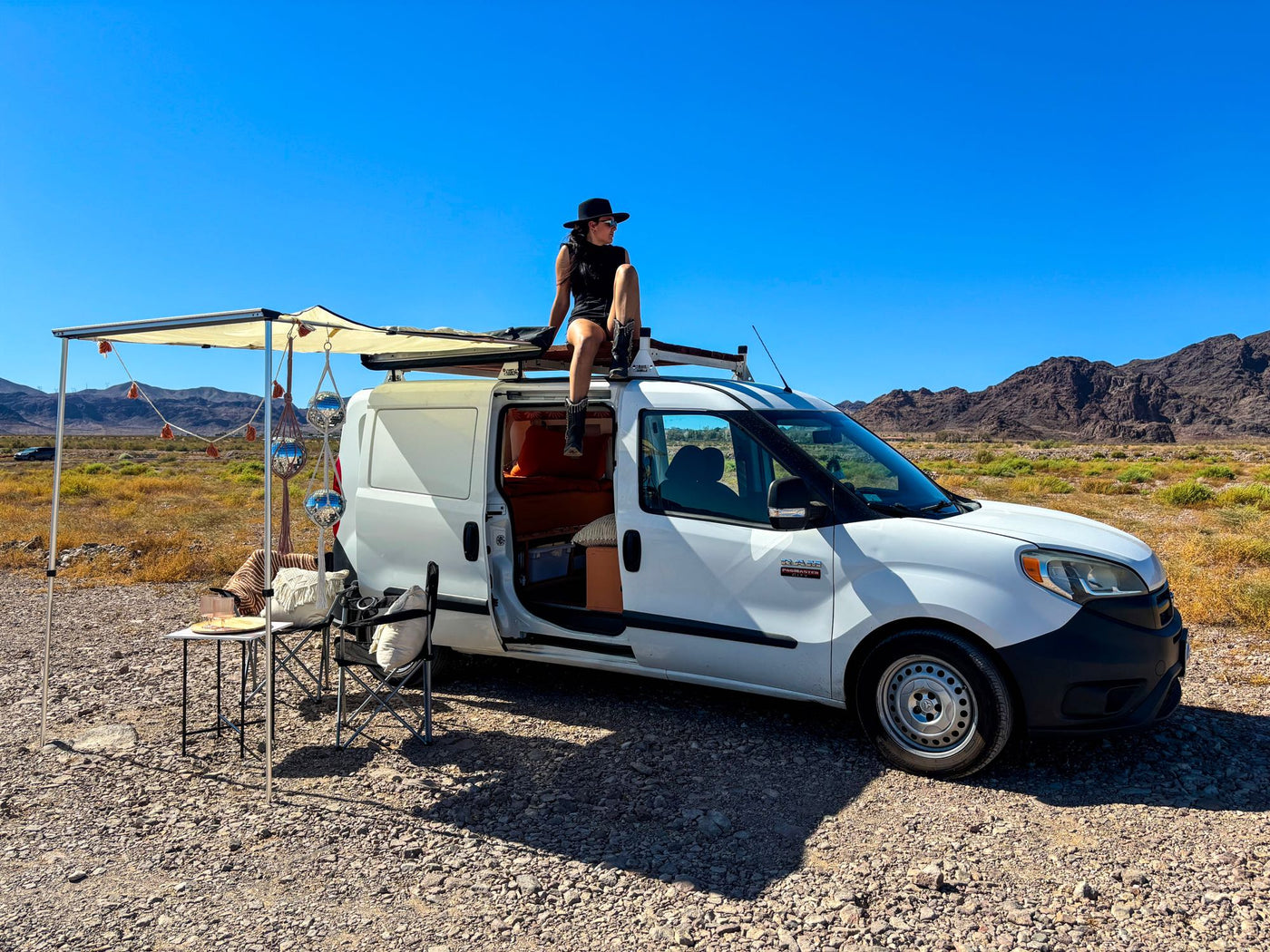 Explore the desert in this RV rental van! Featuring an awning — photo 1