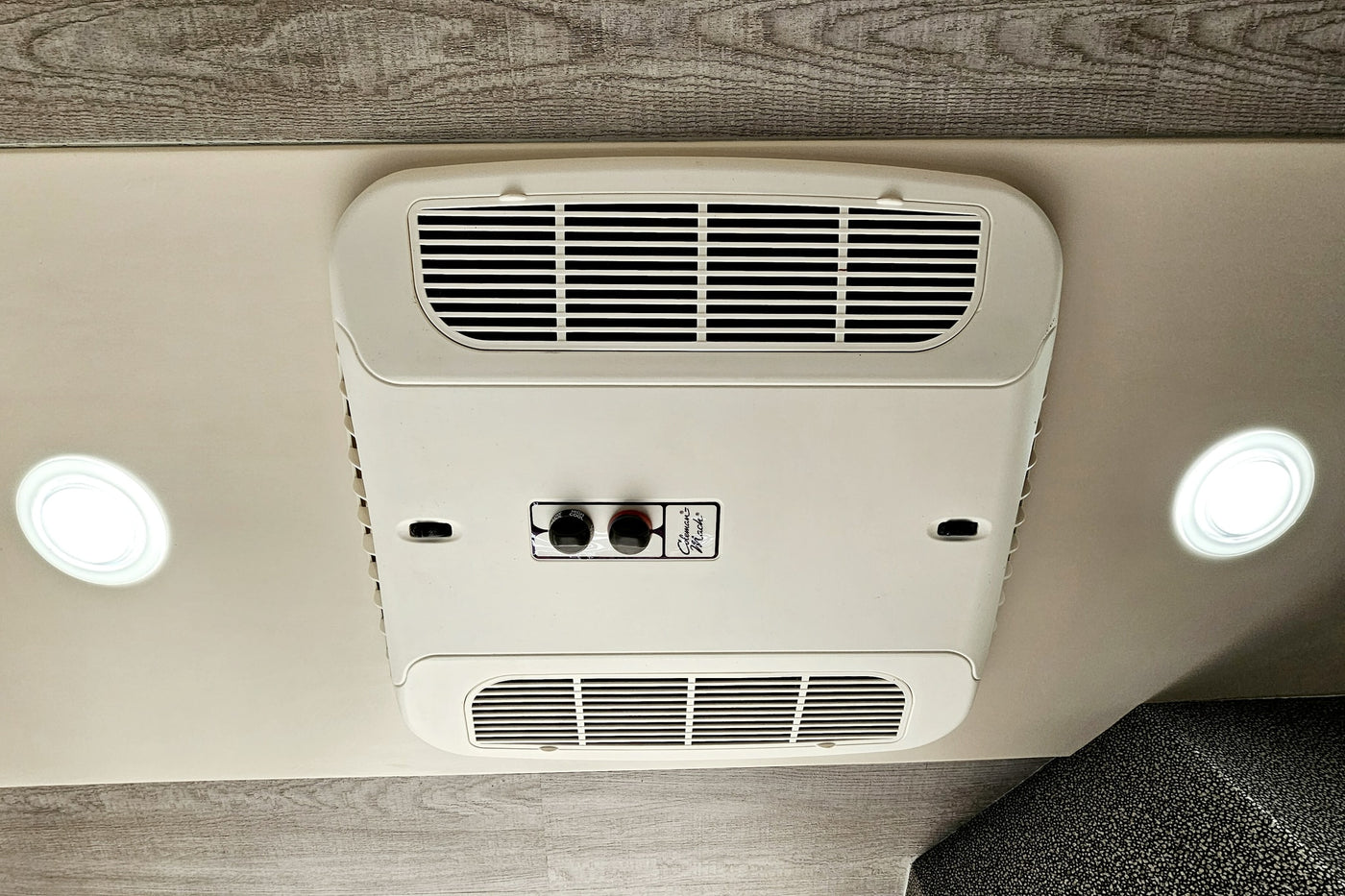 featuring a ladder to a roof rack and modified rear door hinges.|Inside this RV rental: kitchen with stove — photo 18