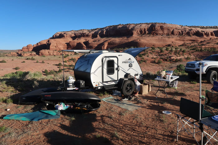 offering adventure in a stunning landscape.|Teardrop RV rental with awning extended