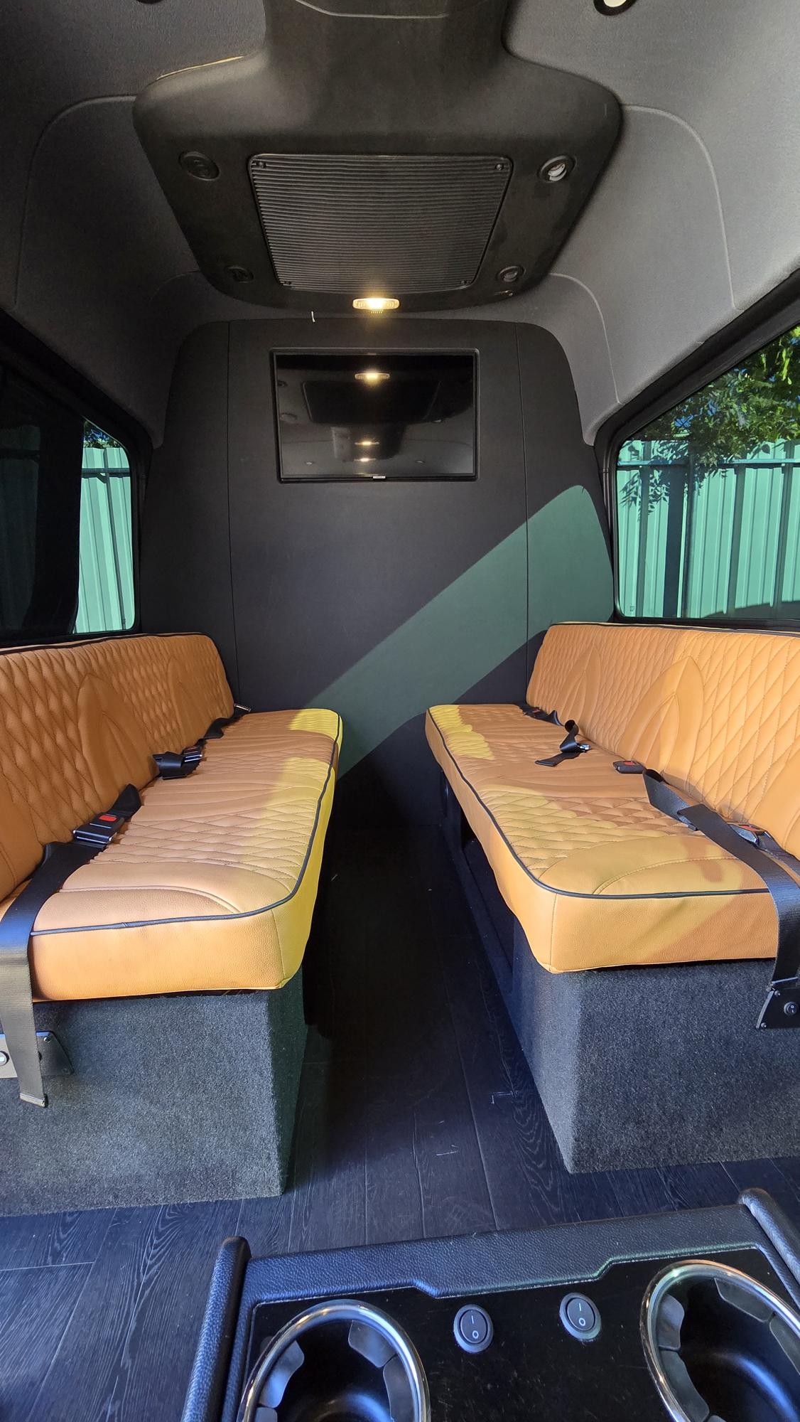 and quilted seats for a comfortable journey.|Luxury rv rental interior: plush quilted leather captain's chairs — photo 4