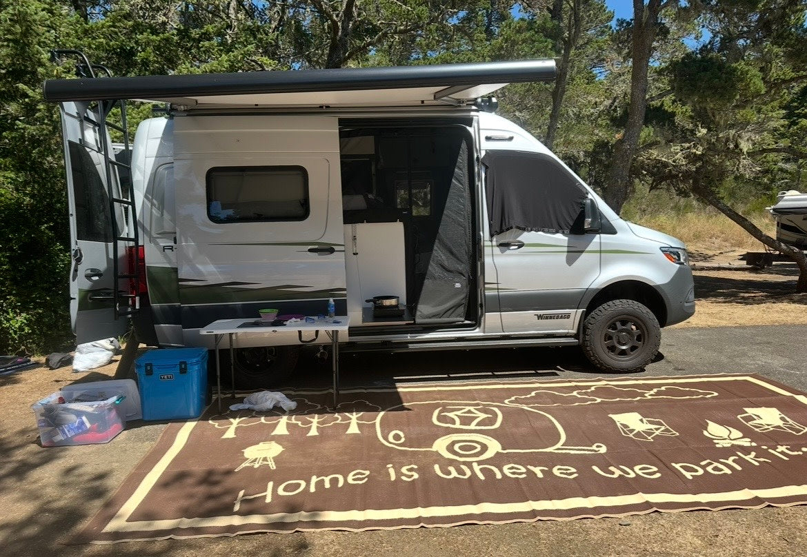 This RV rental Winnebago camper van is set up for camping — photo 1