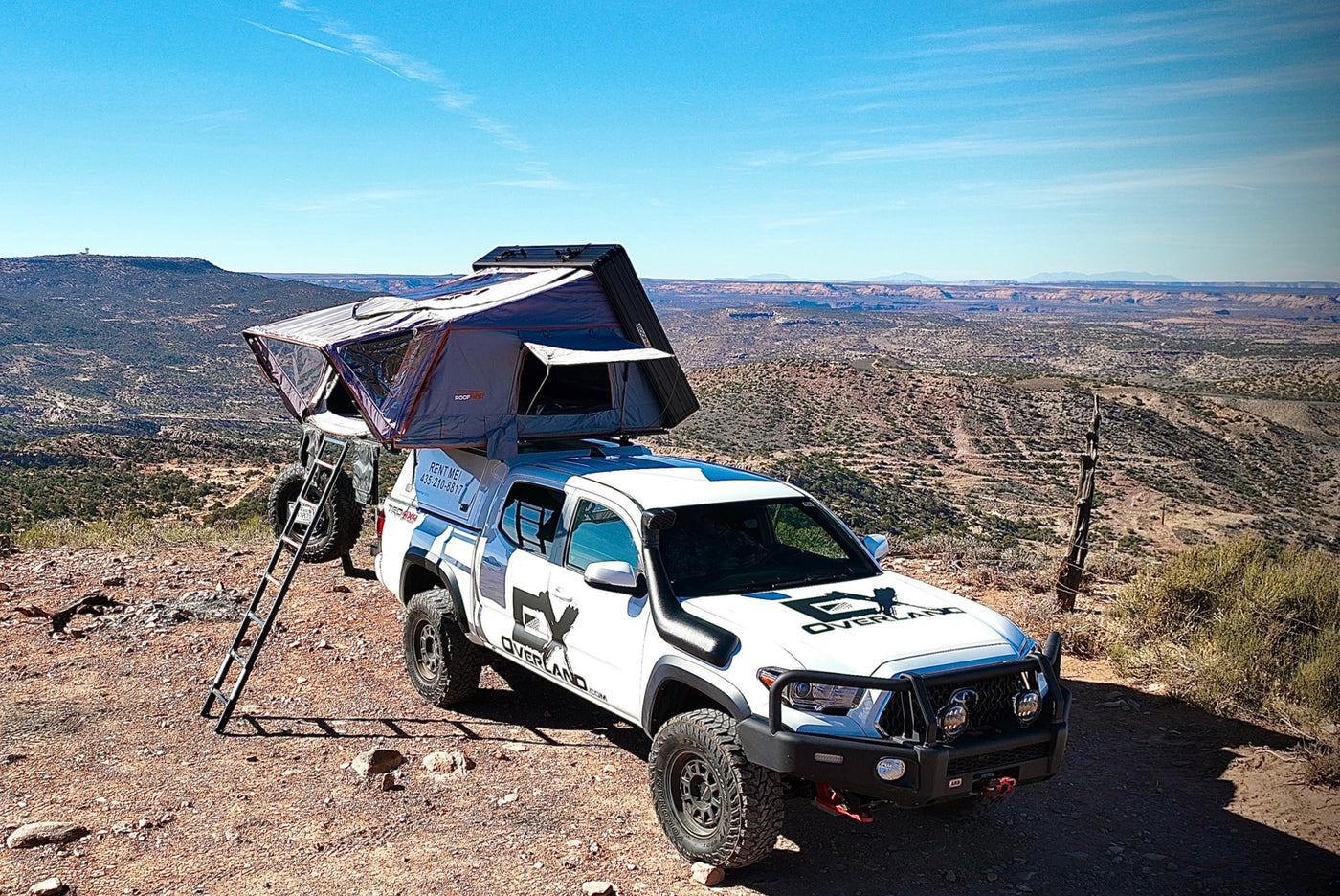 Overland RV rental: White Toyota Tacoma 4x4 with a rooftop tent, ready for desert adventures & off-road camping. — photo 10