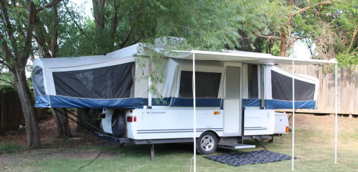 and small kitchen.|Pop-up camper rv rental interior: dining area with table — photo 5
