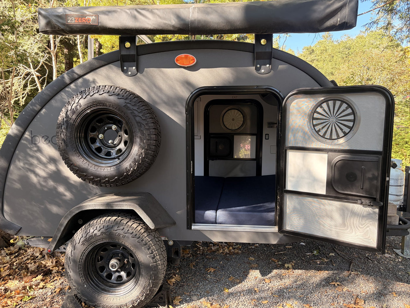 Rear hatch open showing galley area and mounted spare tire — photo 7