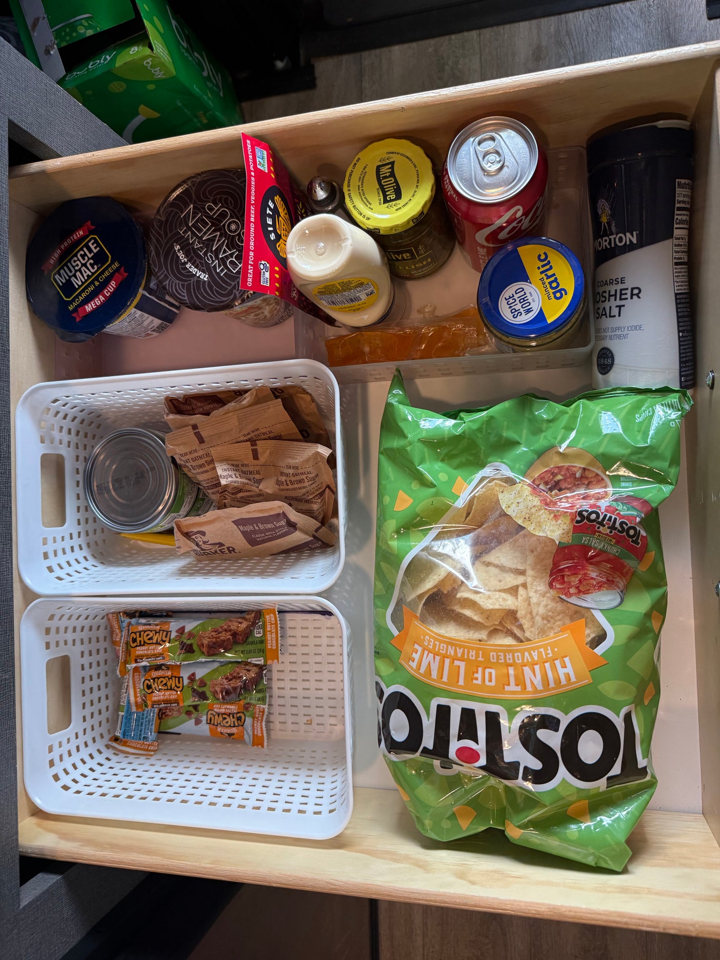 RV rental pantry drawer: instant meals, chips, snacks, oatmeal, granola bars, relish, garlic, salt, soda. All set!