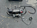 SmittyBilt 9500 pound electric winch on cradle. Mounts on receiver