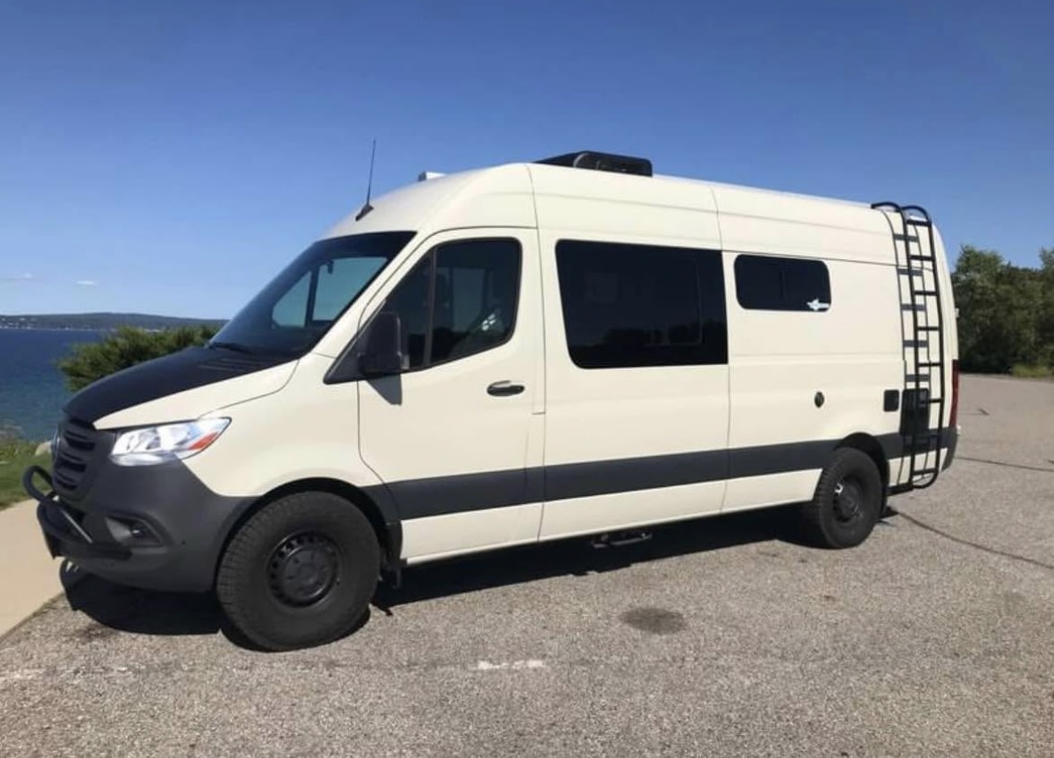 Two-tone cream and black Mercedes Sprinter camper van