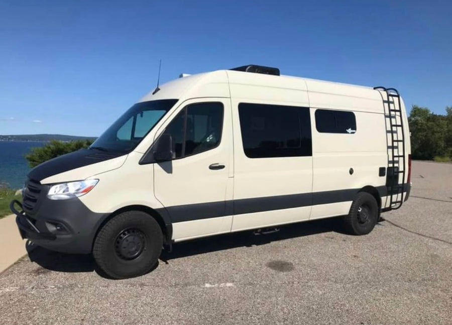 Two-tone cream and black Mercedes Sprinter camper van