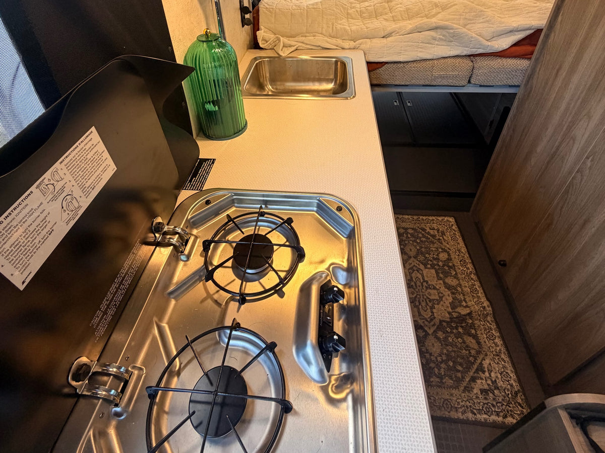 showcasing its interior. Another Solis van is parked behind.|RV rental front cabin interior: dashboard — photo 7
