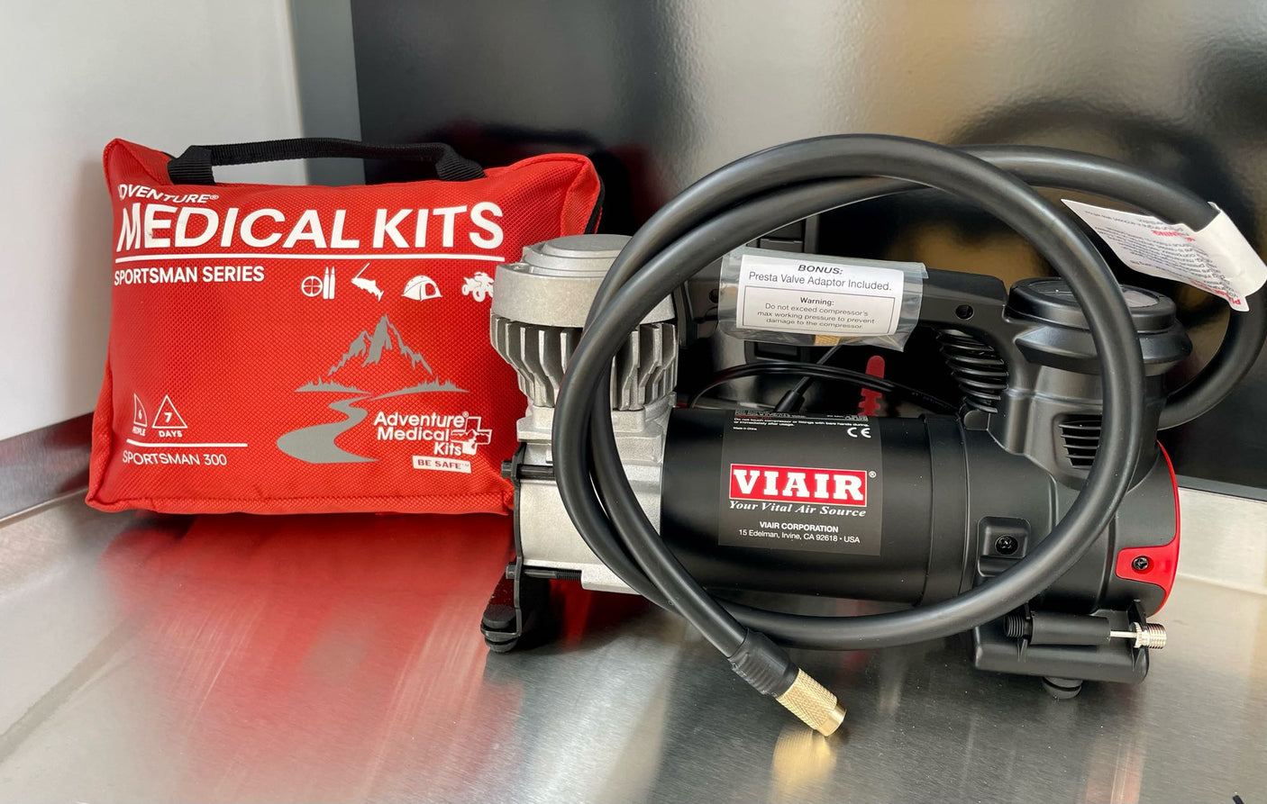 RV rental essentials: A VIAIR air compressor & Adventure Medical Kit for safe travels and outdoor adventures.