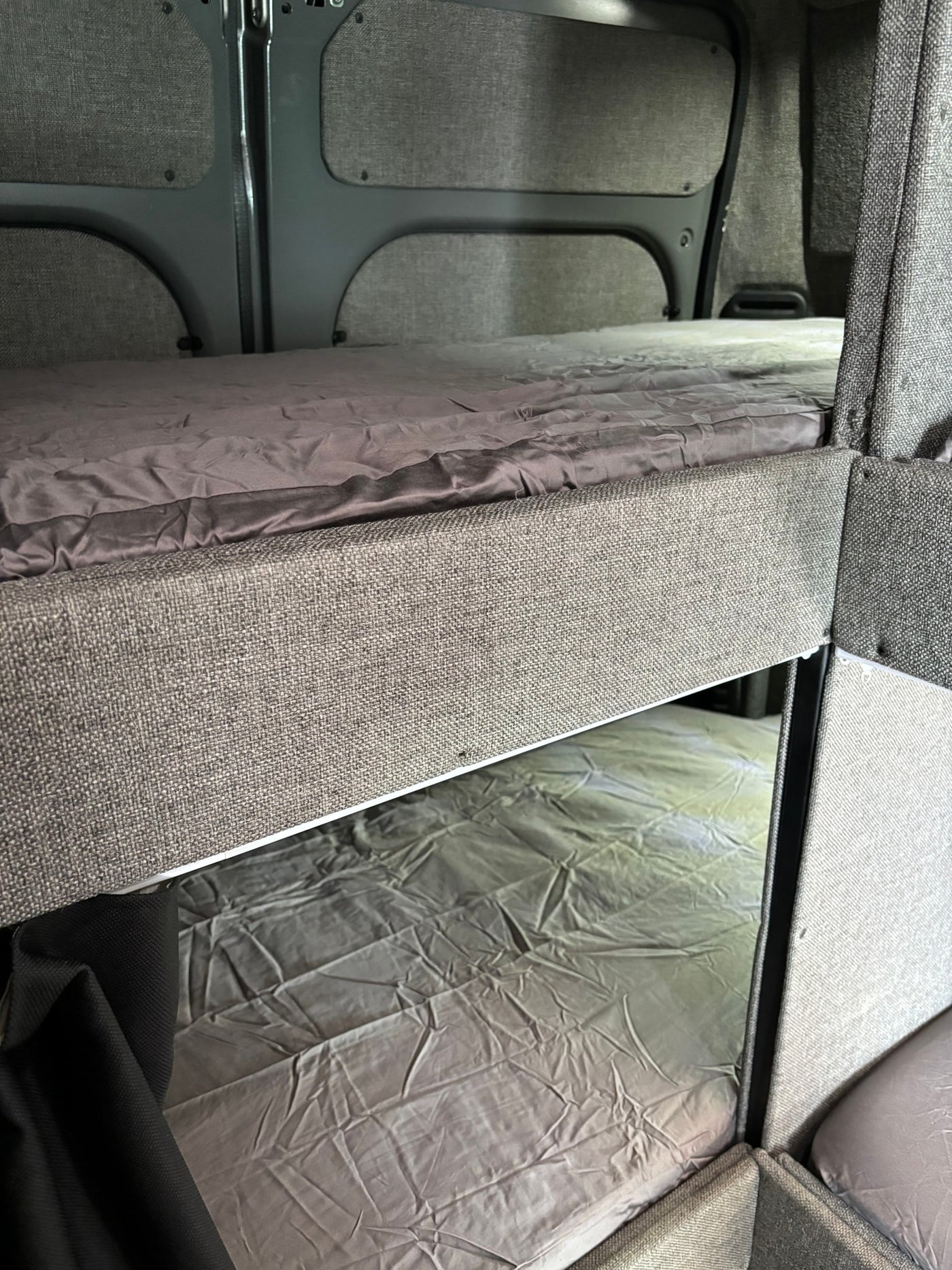 RV rental with comfortable bunk beds and grey bedding, perfect for family adventures. — photo 6
