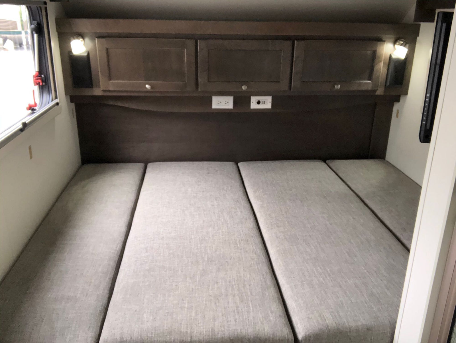 complete with outdoor mats & a bike.|White Subaru SUV hitched to a gray "Boondock Lite" teardrop trailer