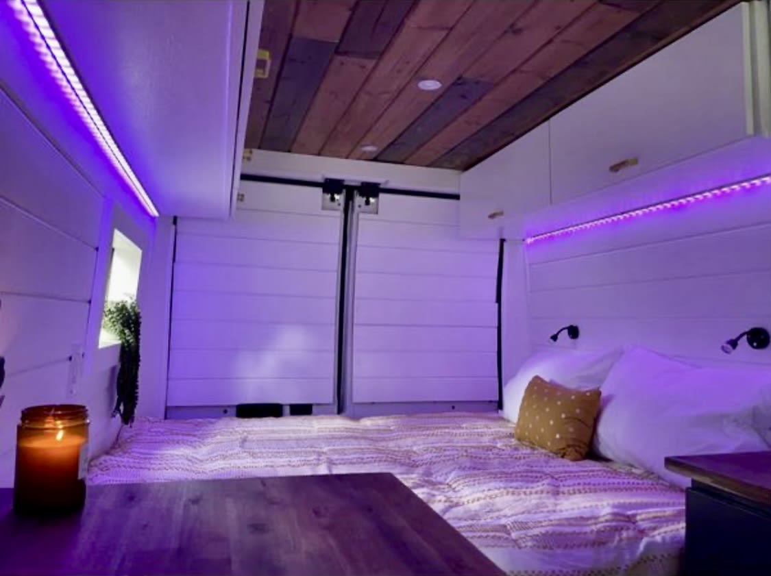 and blue accent lighting.|Inside a spacious custom RV rental