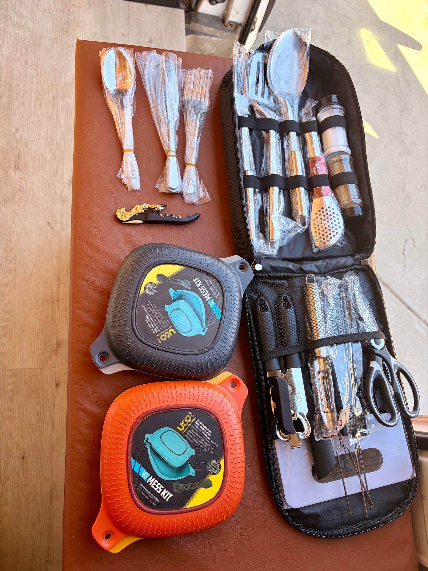 RV rental kitchen essentials: UCO mess kits, cooking utensils, and cutlery for camping adventures.