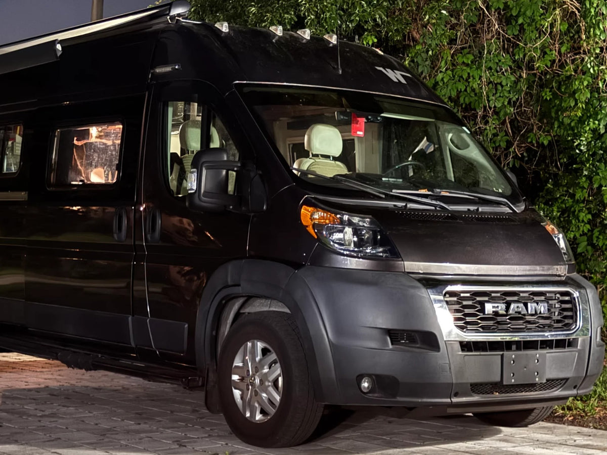 A black RAM ProMaster camper van — photo 1