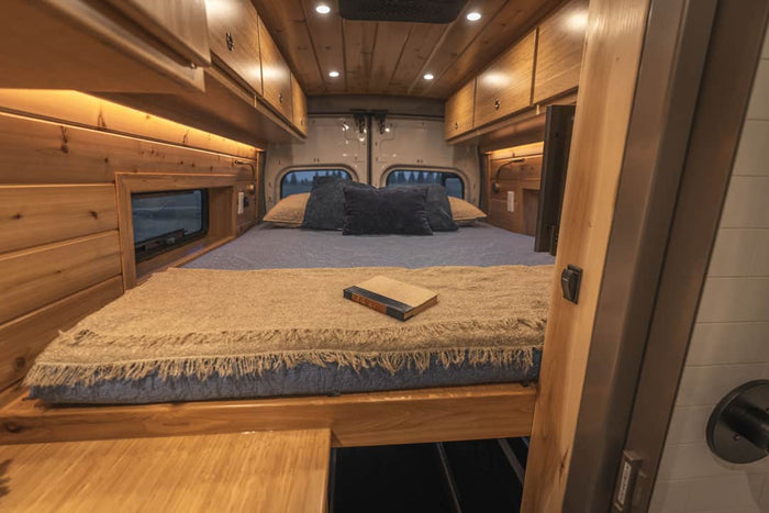 and dinette. Explore comfort on wheels.|This white Ford Transit camper van