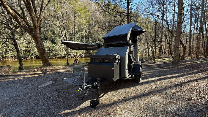 & chairs. Perfect nature escape.|This RV rental's rooftop tent offers a sleeping area
