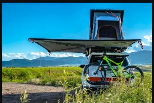 featuring a deployed Alu-Cab rooftop tent.|Adventure-ready RV rental with rooftop tent