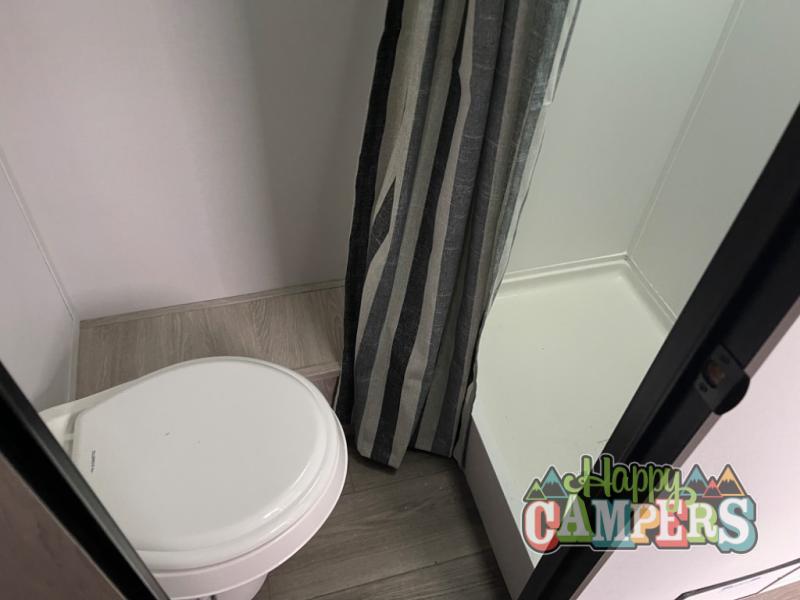 plus a bed area.|A cozy RV rental dinette featuring two upholstered benches