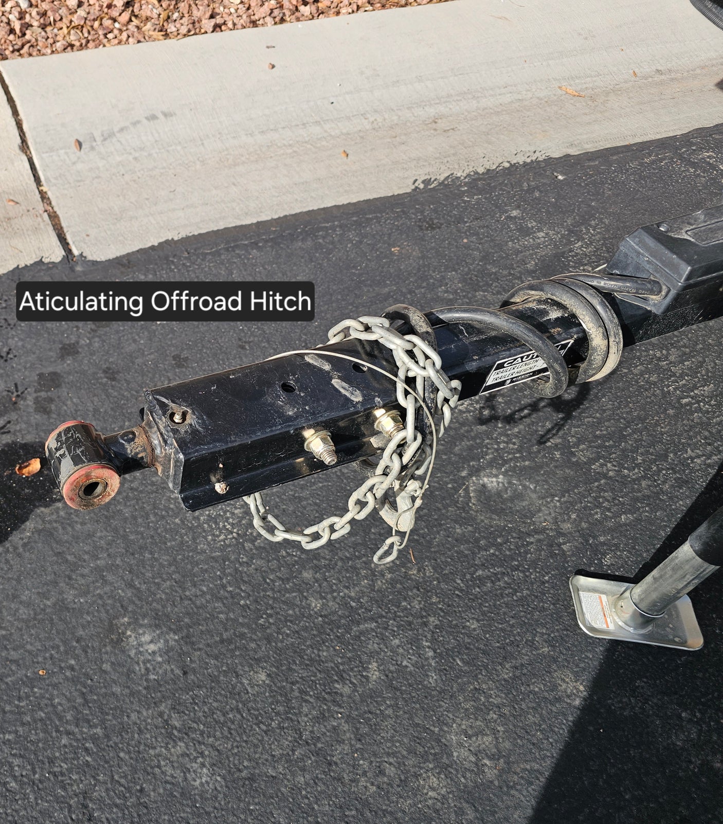 This articulating offroad hitch, crucial for rv rental adventures, offers superior trailer flexibility & safe towing on rugged terrain.
