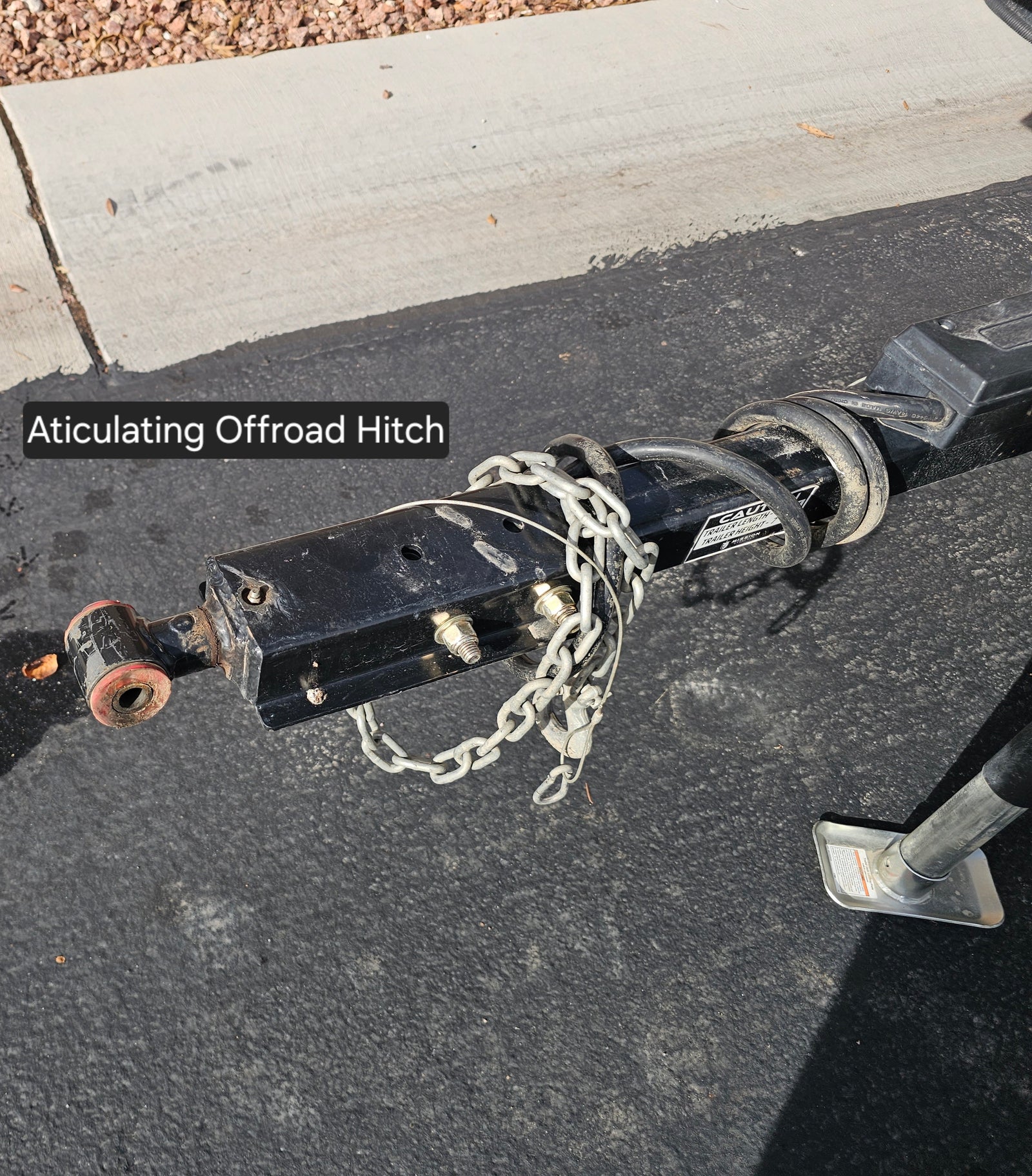 This articulating offroad hitch, crucial for rv rental adventures, offers superior trailer flexibility & safe towing on rugged terrain.