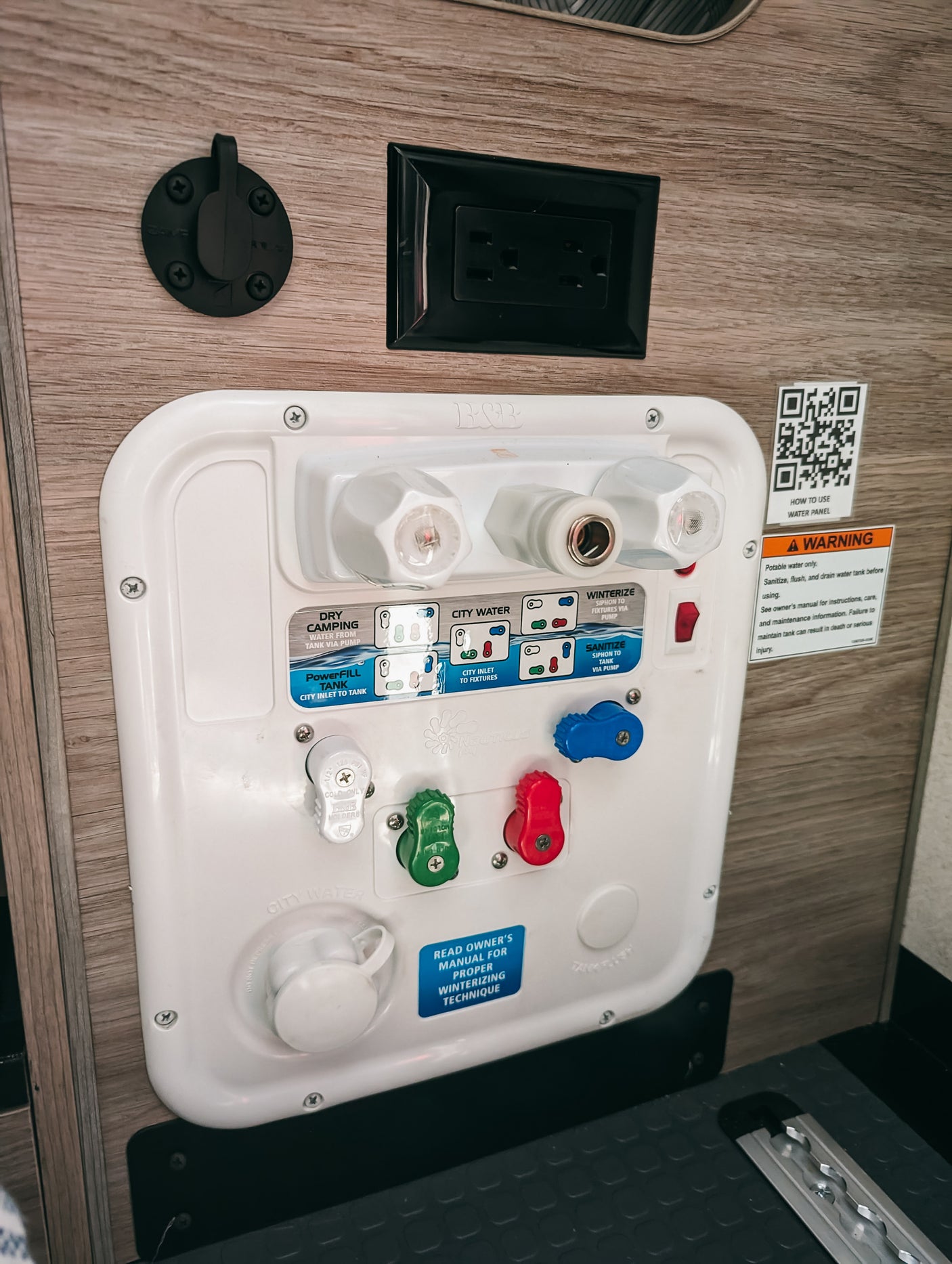 This RV water control panel features multiple valves and modes for connections like city water, dry camping, and winterizing, ideal for RV rental.