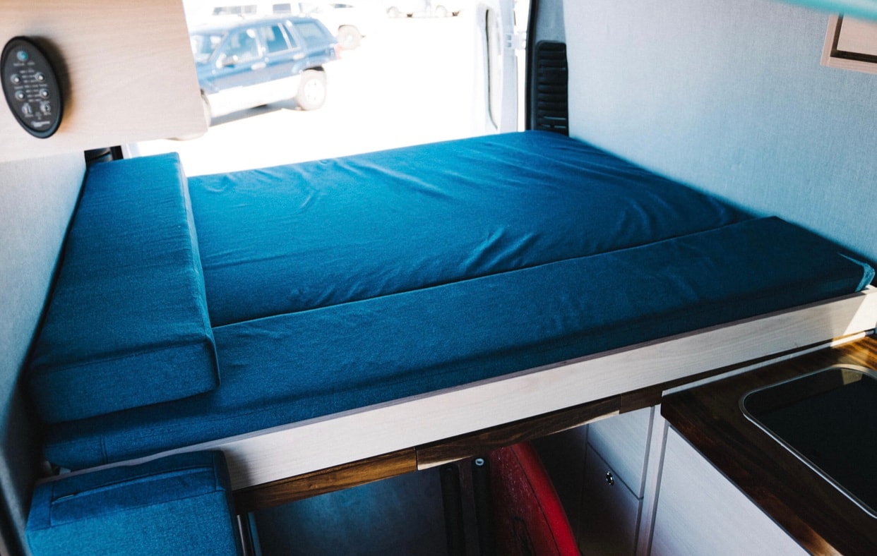 plus the front cabin area with driver & passenger seats.|View inside an **rv rental** — photo 3