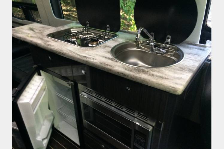 and a Samsung Blu-ray player for entertainment.|RV rental: Close-up of Samsung Blu-ray player mounted below cabinet