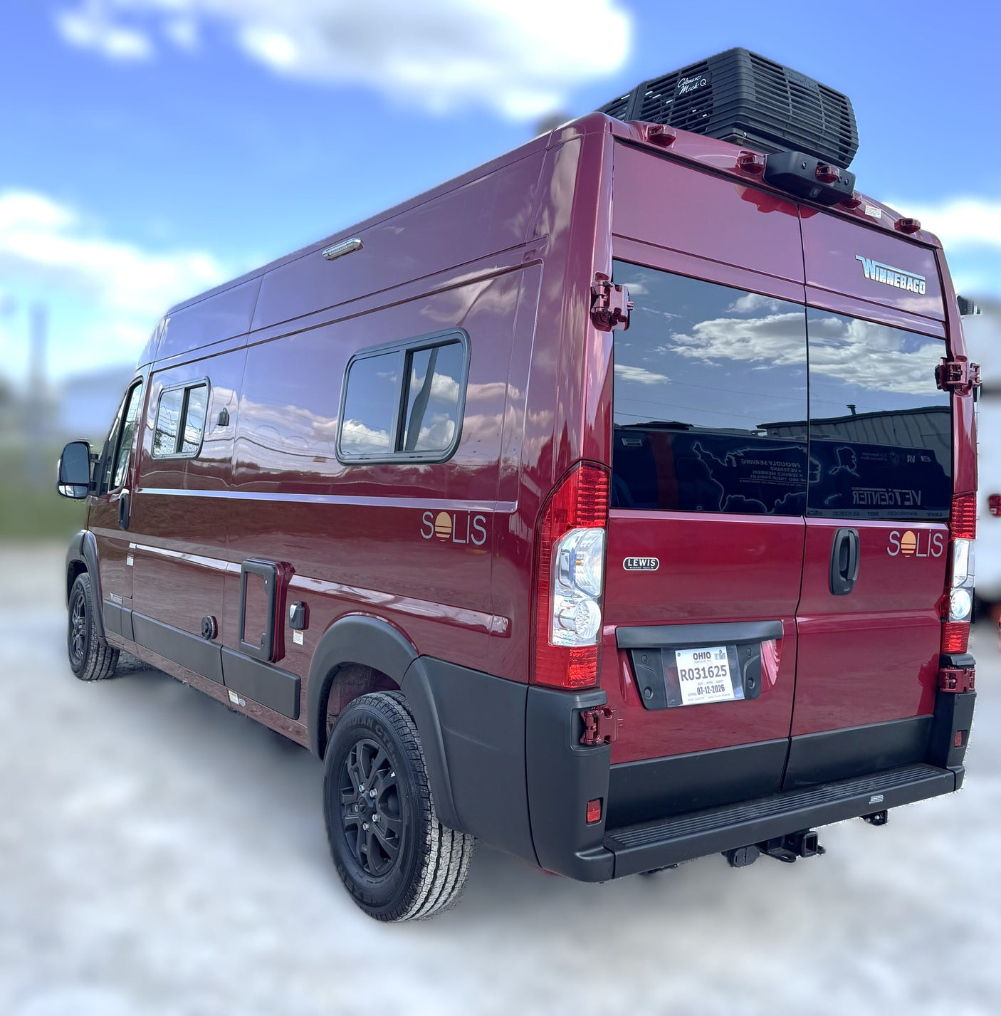 This burgundy Winnebago Solis camper van with rooftop AC and Ohio plate is perfect for your next rv rental trip.