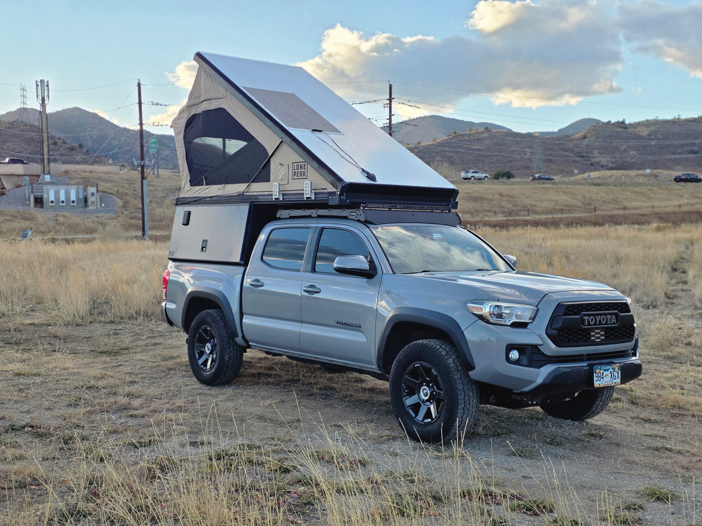 Toyota Tacoma with a pop-top overland camper, great for your next rv rental adventure with solar-powered off-grid camping.
