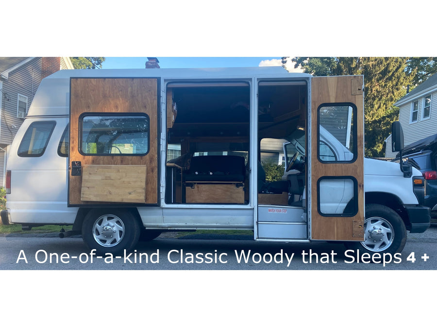 Experience this unique woody camper van for your next RV rental. Sleeps 4+ with custom wood panels and a welcoming interior.|Cozy RV rental interior with custom wood trim