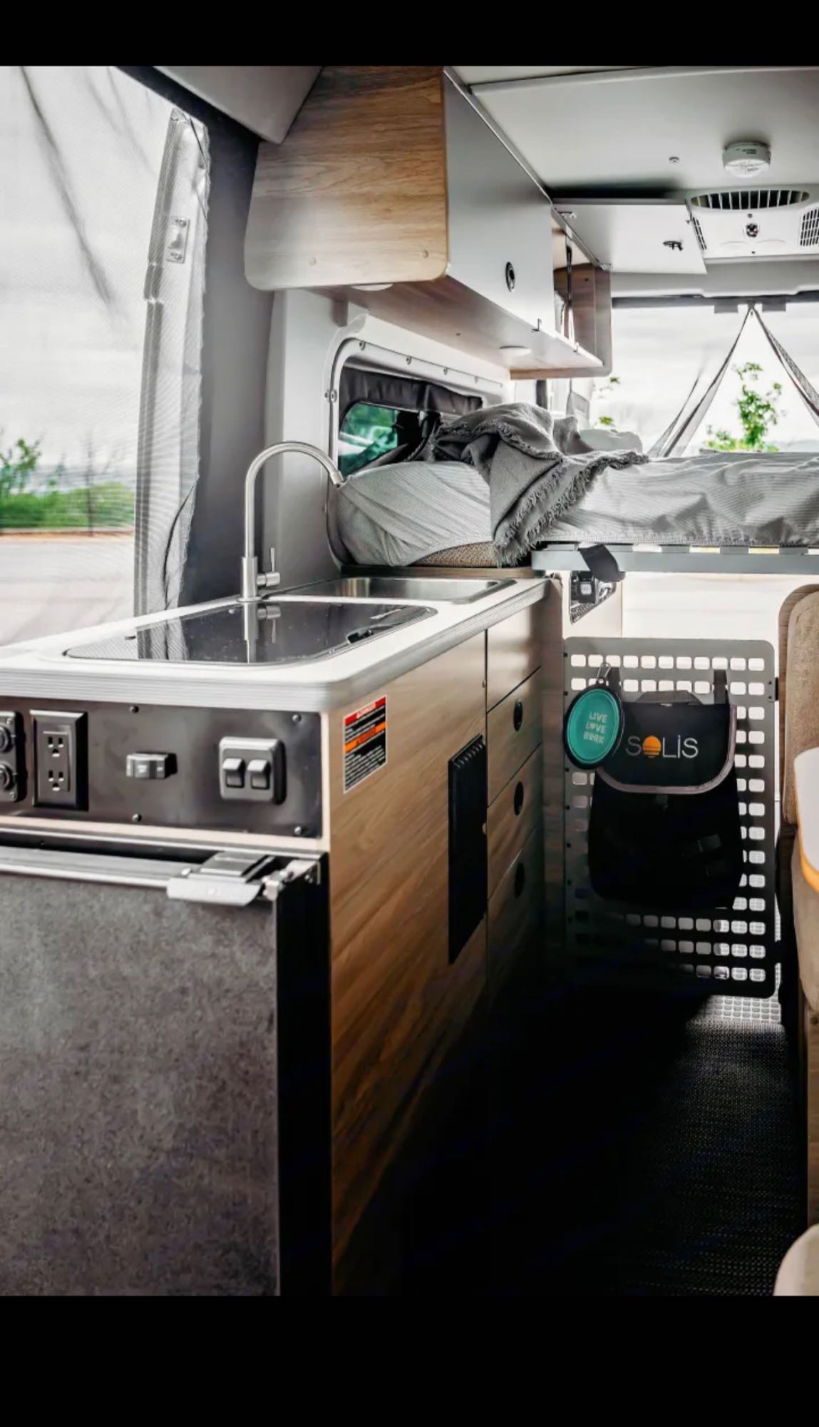 and stunning lake views.|A sleek Winnebago Solis RV rental
