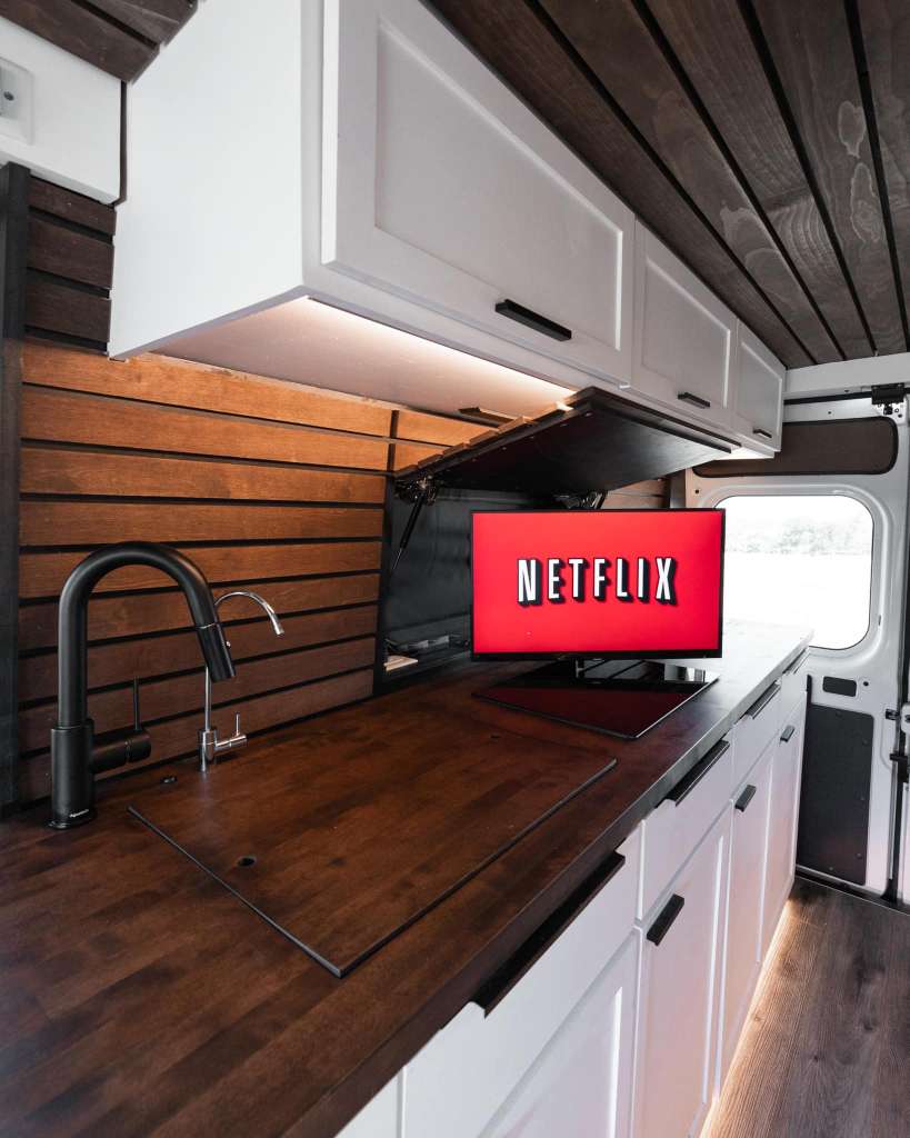 and bright lighting create a cozy space.|Digital nomad in a modern RV rental