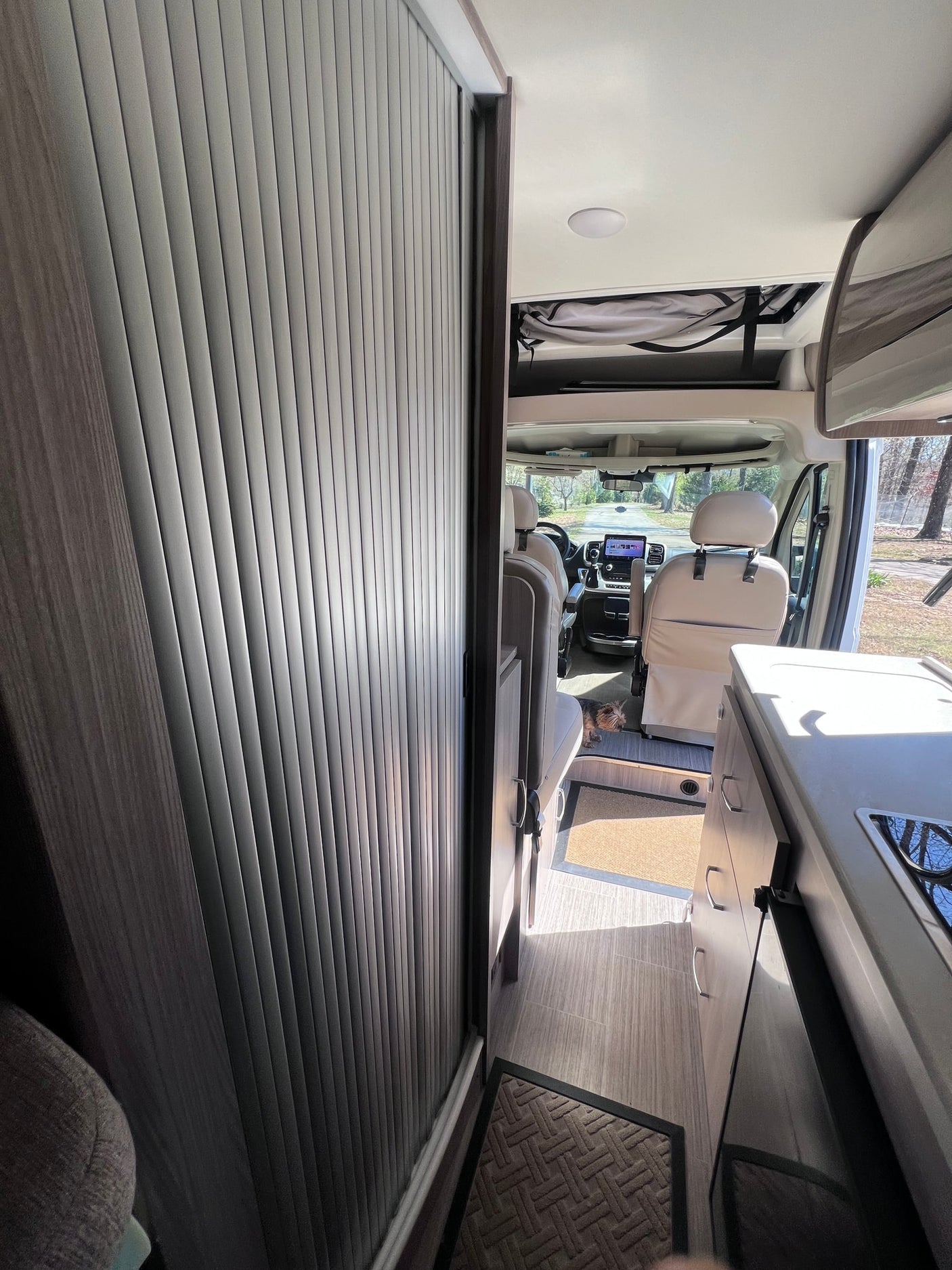 and overhead controls.|Scenic RV rental interior: skylight with mountain views