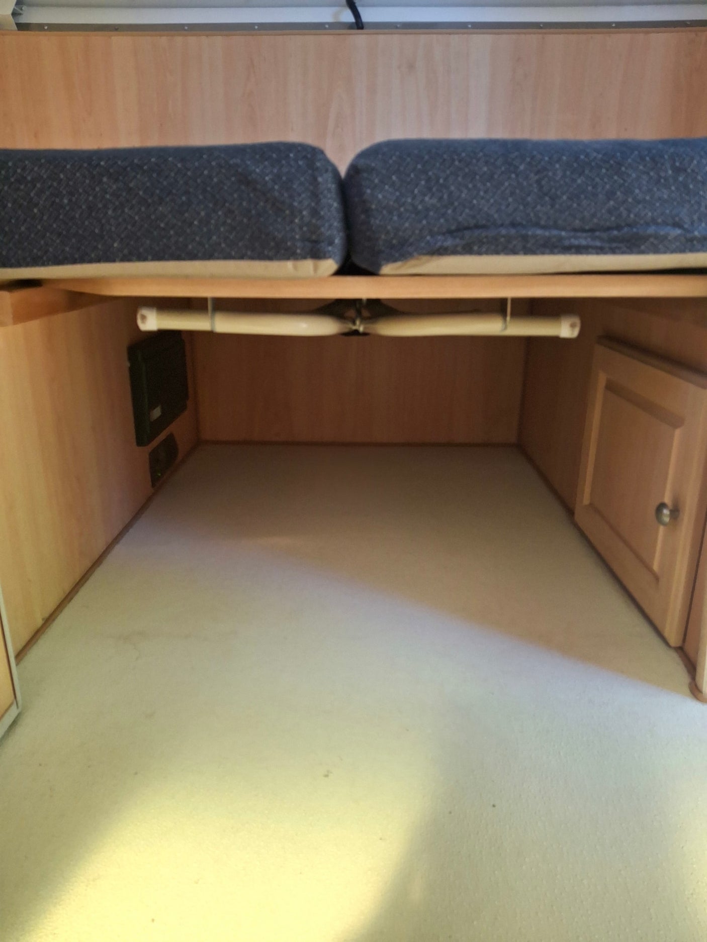 and a window view.|Cozy RV rental interior with bench seating