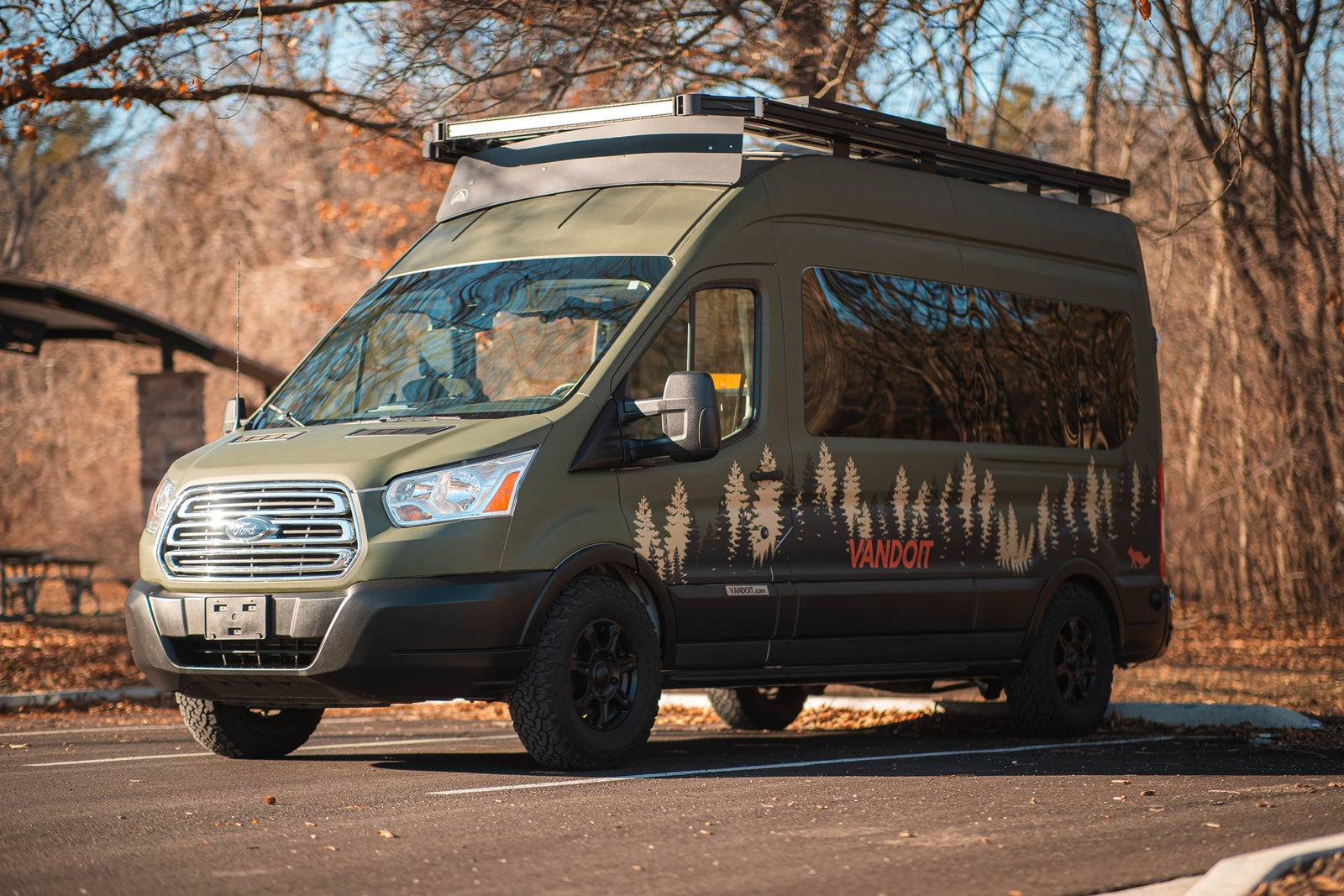 an adventure van with forest decals