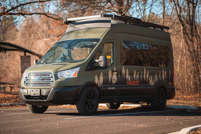 an adventure van with forest decals